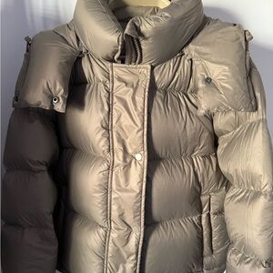 Woman’s down jacket. Water resistant . New without tag .